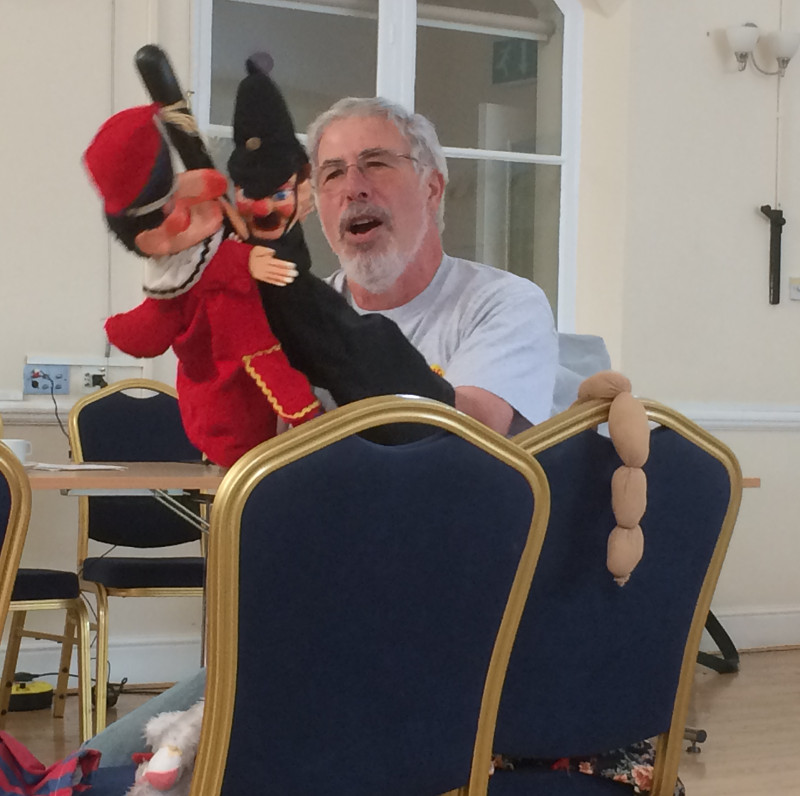Michael Berg performing with Punch and the Policeman at Dementia Club UK